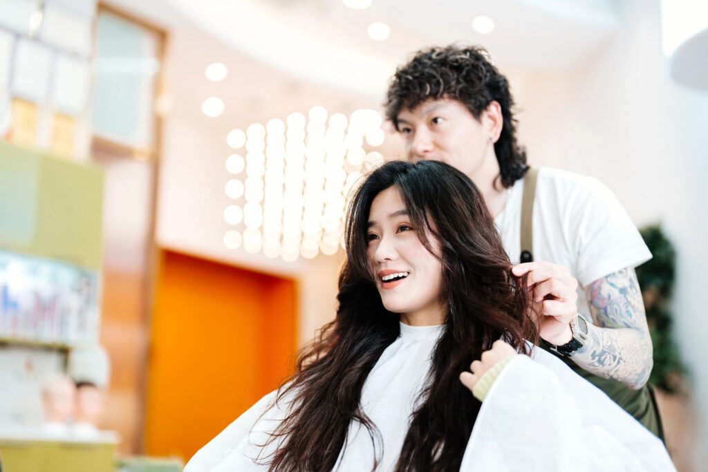 Stylist consulting with a client during a haircut appointment
